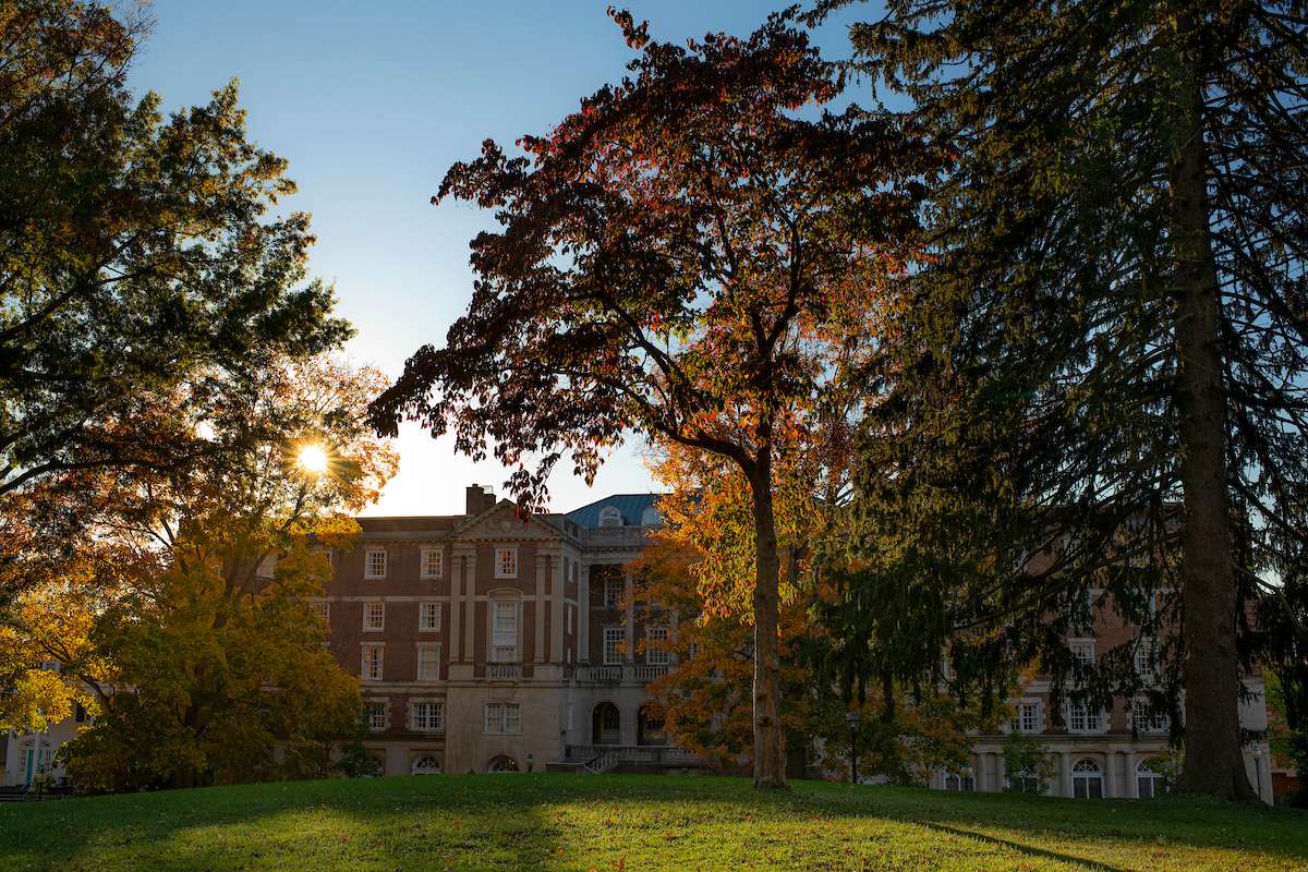 The sun peaking over Lindley Hall