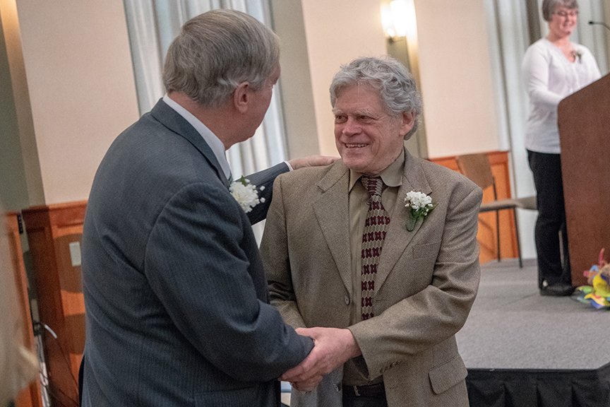 Fred Weiner is congratulated by President Duane Nellis