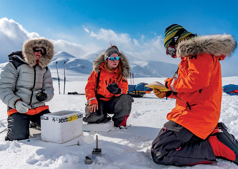 Nina Adanin [RIGHT] and her fellow “Climate Sentinels” collect snow samples in one of the fastest-warming regions on Earth. Photo by Heidi Sevestre