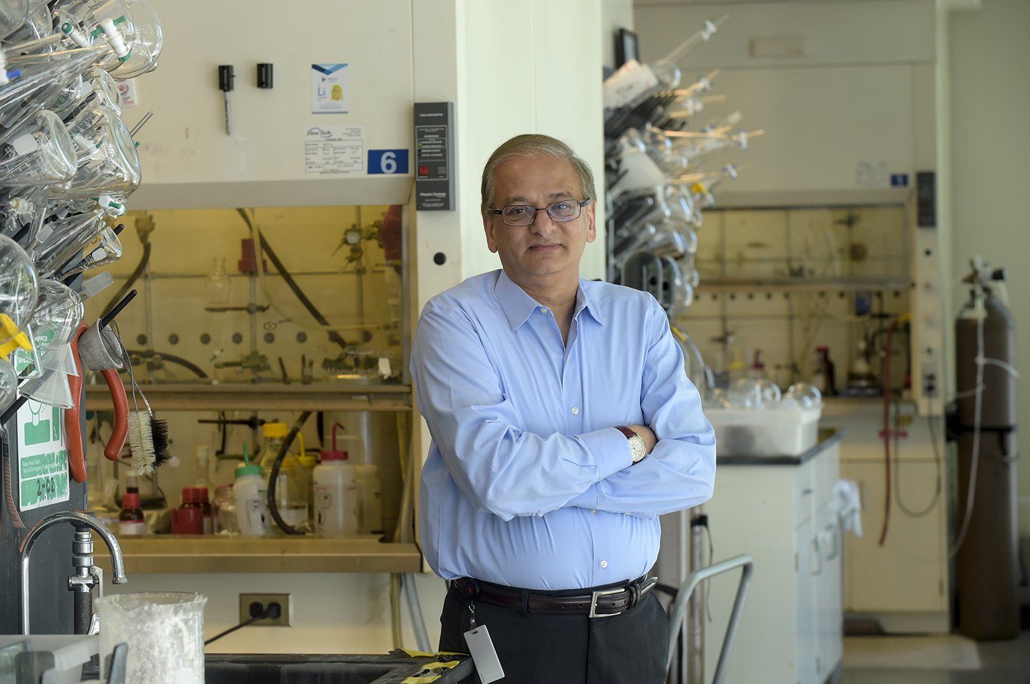 Milind Deshpande, PHD ’87 posing in his lab