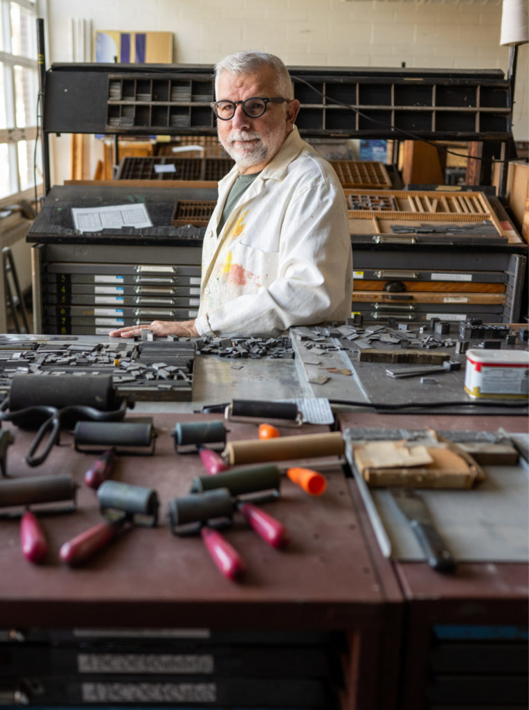 Don Adleta poses in the TypeShop and Bindery workshop