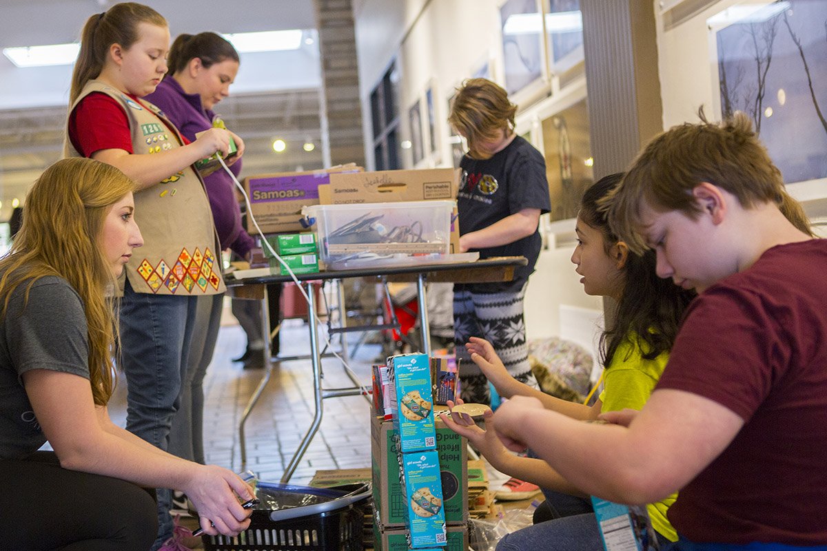 Russ College of Engineering and Technology SWE members help local Girl Scouts construct their own Rube Goldberg machines at an event at the Market on State