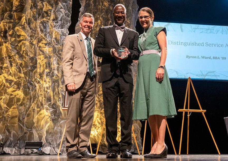 Recognized with a Distinguished Service Award from the Ohio University Alumni Association in fall 2022, Byron Ward (BBA '89) paused to celebrate his achievement with Ohio University Alumni Association (OUAA) Board Chair Jeff Laturel (BSC '80, MBA '82) and OUAA Executive Director Jenn Bowie (BJS '94, MSC '99). Photo by Rich-Joseph Facun, BSVC '01