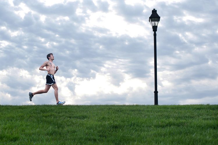 Tomas Liauba, BSED ’15, takes a spring-time run on the Bikeway. 