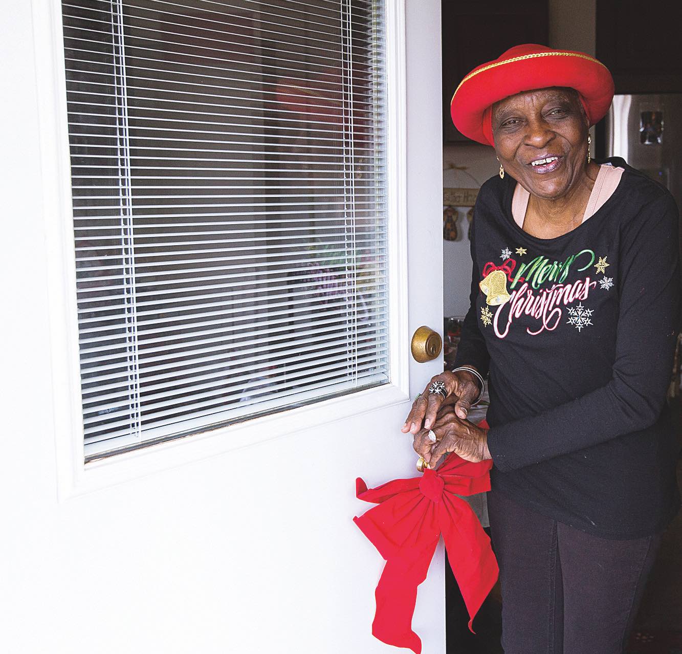 Francine Childs stands at her front door