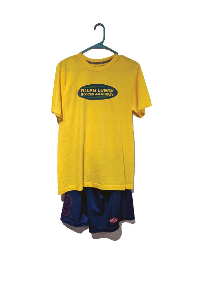 Yellow tshirt and blue athletic shorts