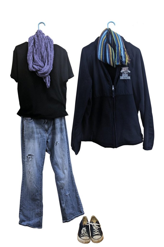 Black sweatshirt, purple scarf, jeans and black sneakers
