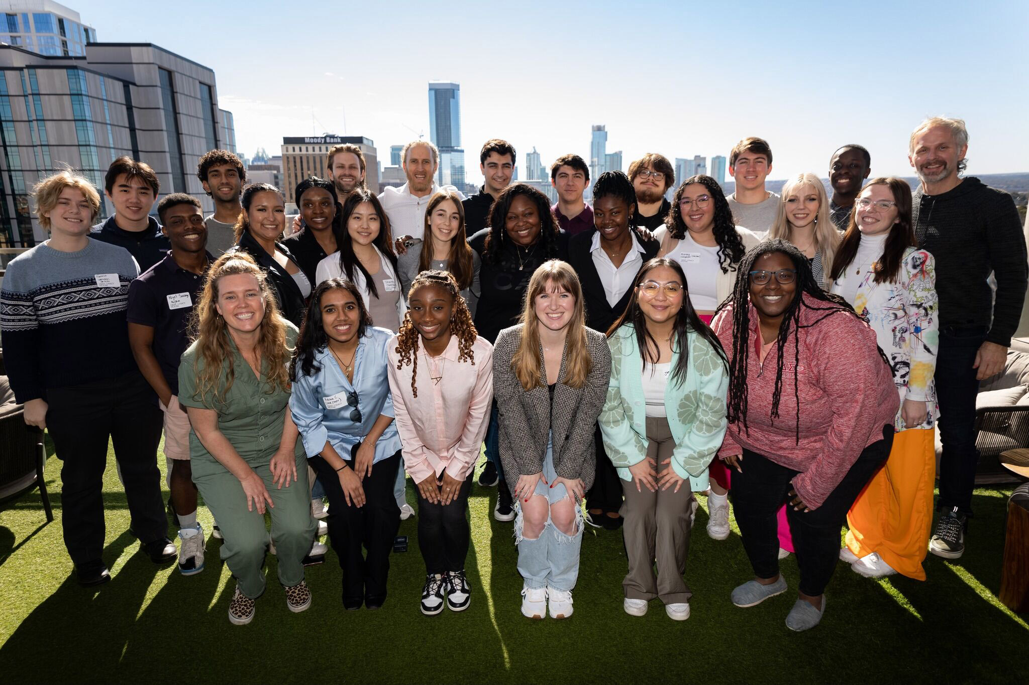 Three Ohio University students are pictured with their cohort in the Democracy House’s Young Leaders Civic Action Program