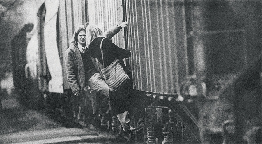 Students hitch a ride across campus on a freight train in this photo in the Feb. 7, 1975 Post. Courtesy of the Mahn Center for Archives & Special Collections