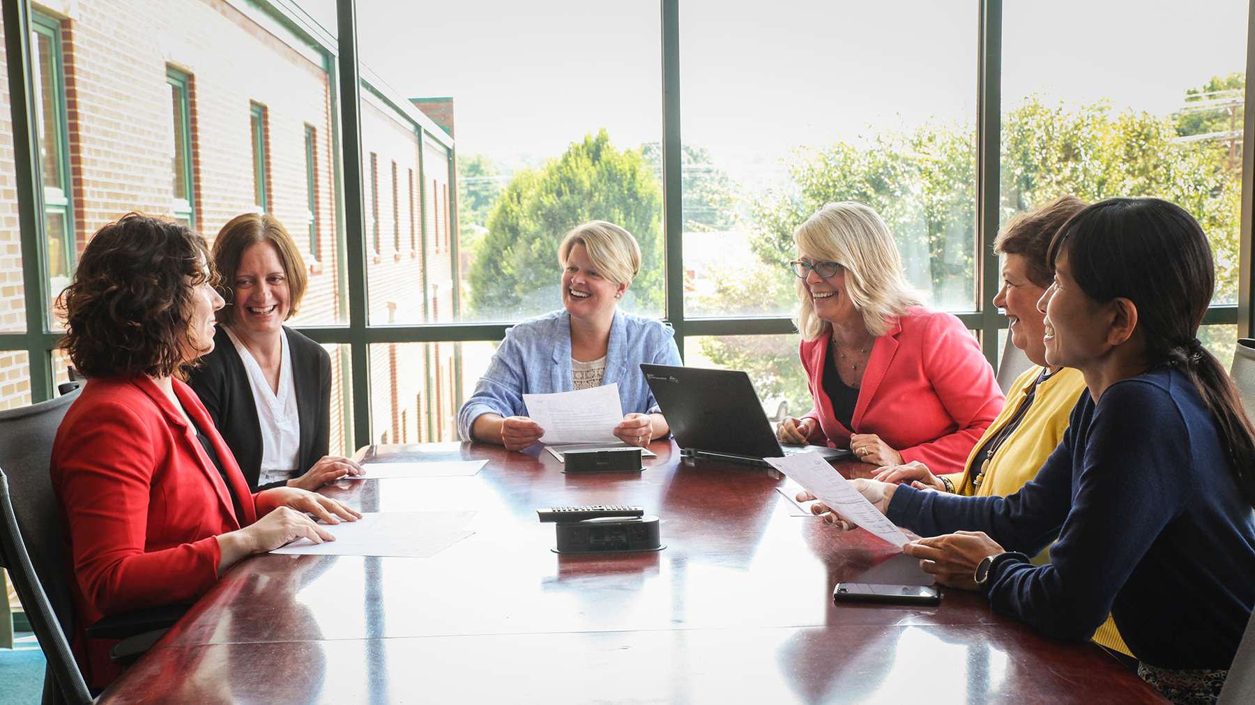  Ohio University Innovation Center’s all-female staff gather at the West State St. facility: [LEFT to RIGHT] Client Services Manager and Executive Coach Erin Rennich, MBA ’13; Accountant Jennifer Pauwels; Director Stacy Strauss; Associate Director Tanya Conrath, BSC ’93; Administrative Specialist Susan Bauman, BSED ’94; and Lab Director Misako Hata, BSISE ’98, MS ’01, MS ’10. Photo by Ellee Achten, BSJ ’14, MA ’17