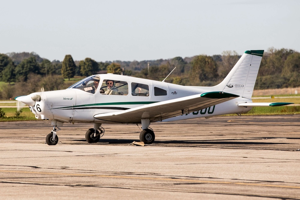 two people in a small plane