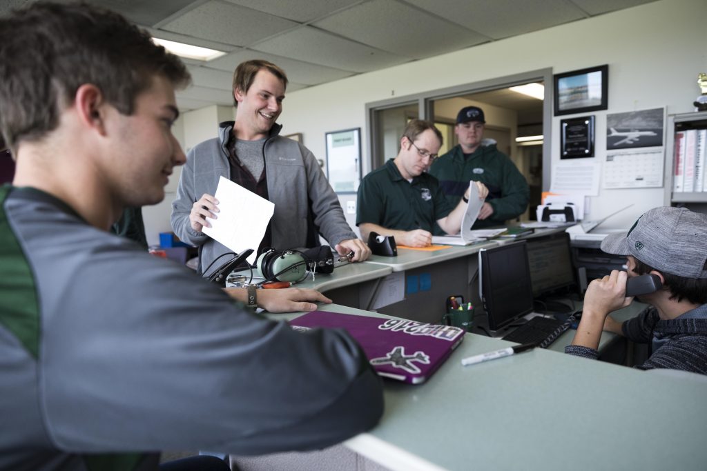 pilots sitting and talking in an office