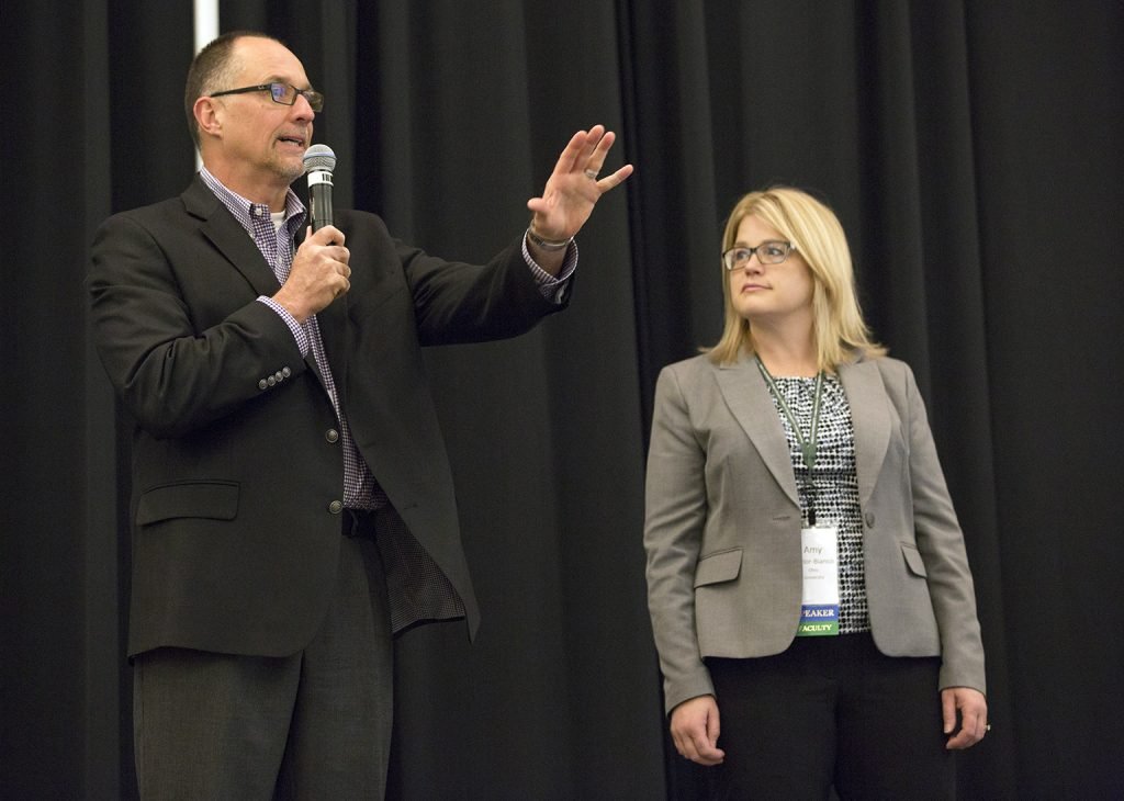 Tim Reynolds, BBA ’87 [LEFT], Robert D. Walter Center for Strategic Leadership director, and Amy Taylor-Bianco, associate professor in OHIO’s College of Business, welcome students to one of the center’s events. Photo by Emily Matthews, BSVC ’18