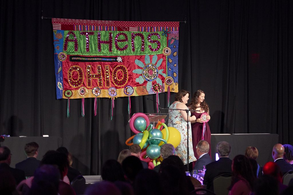 Rachel Ridout is presented with the Kerrigan Family Scholarship Award at the 2018 Student Leadership Awards Gala. Ridout was the creative mind behind the photo series entitled 