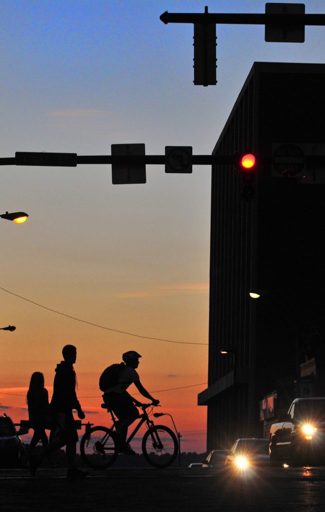 As the sun sets on Court and Union Streets, the uptown area remains busy.