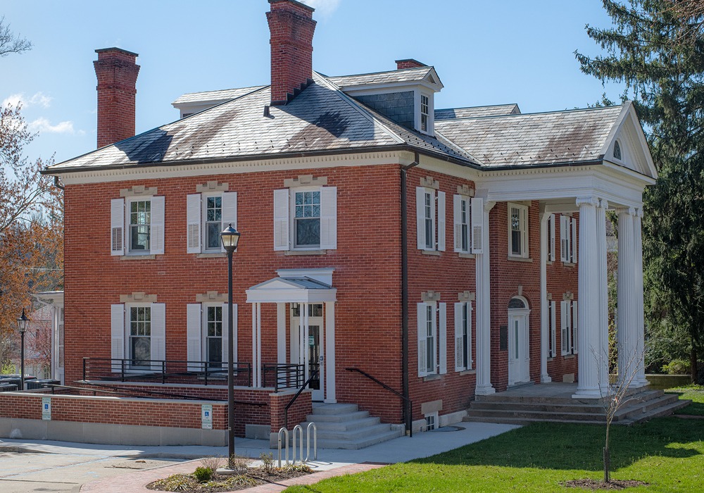 Side view of Konneker, 6 windows, double story, side entrance. brick building