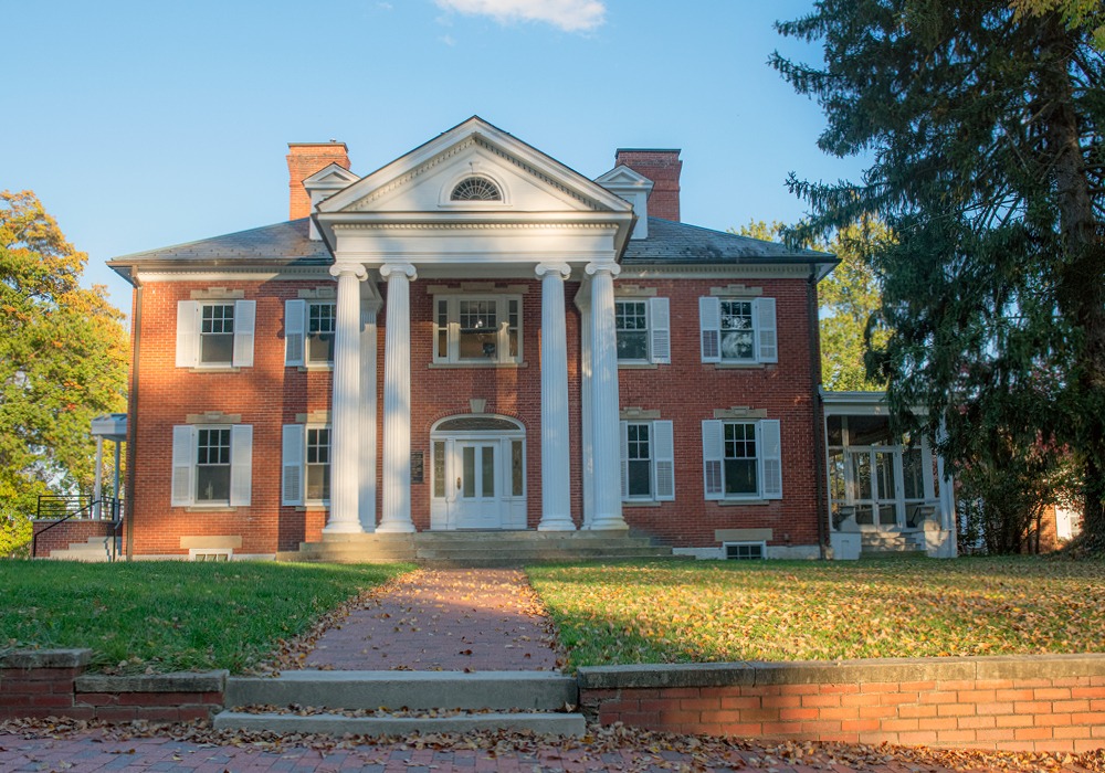 front view of Konneker Alumni Center. Brick building with 4 pillars