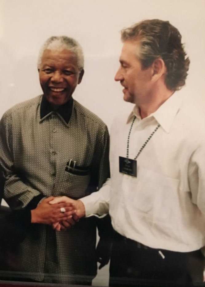 Rick Hawkins’ philanthropy extends to South Africa, where he had a chance to meet with Nobel Peace Prize recipient Nelson Mandela.
