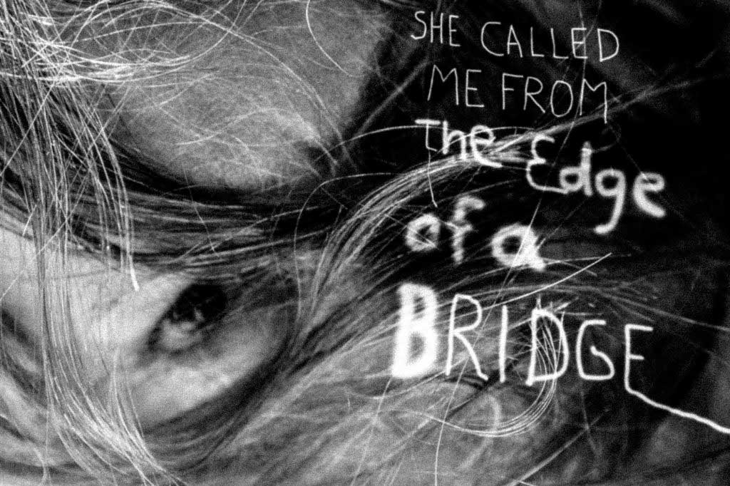 face covered by unkempt hair; text reads: She called me from the edge of a bridge 