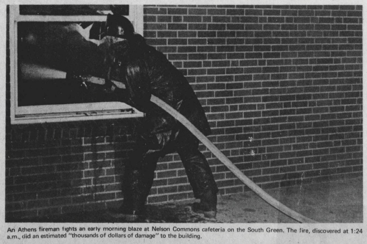 Fireman puts out fire set in kitchen of Nelson Hall.