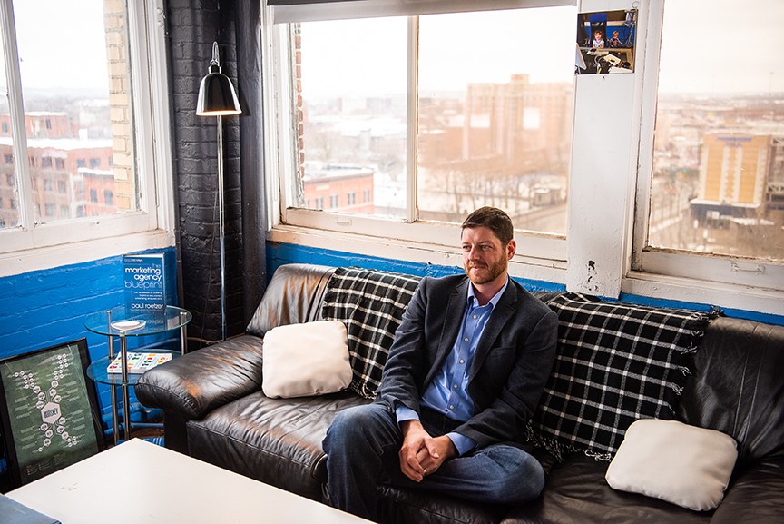 Paul Roetzer on couch in office