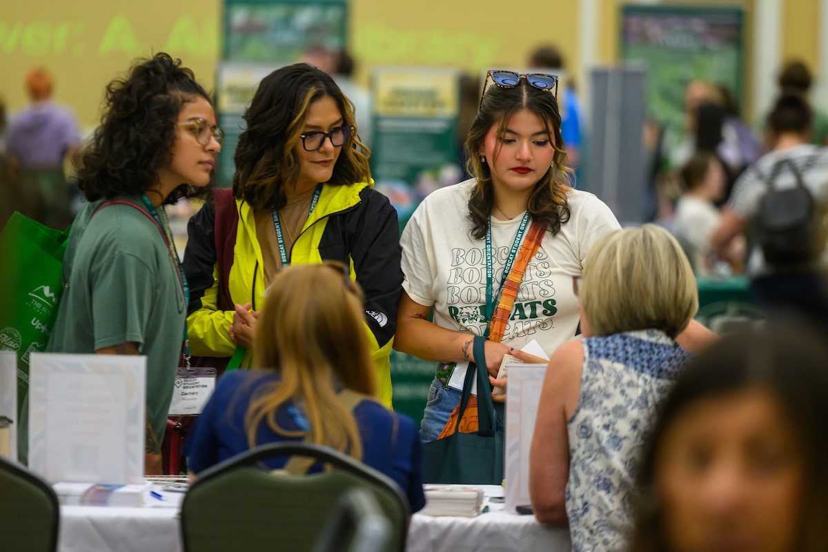 A group of incoming student survey the offerings at a 2024 Bobcat Student Orientation event in Baker Center.