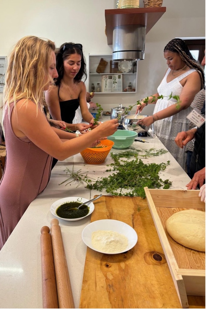 a group of students cook in an Italiam kitchen