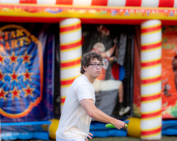 A student throws a frisbee