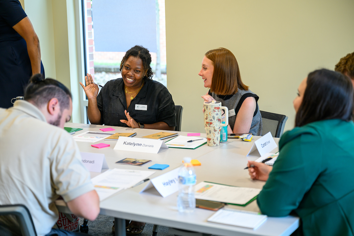 Members of the Young Alumni Leaders talk together during a workshop on Sept. 6 at Ohio University