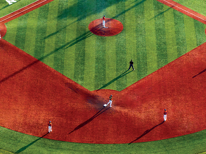 baseball players on base and the pitcher's mound at Bob Wren Stadium