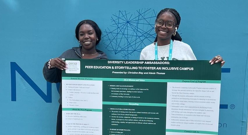 Student pose with their presentation at conference