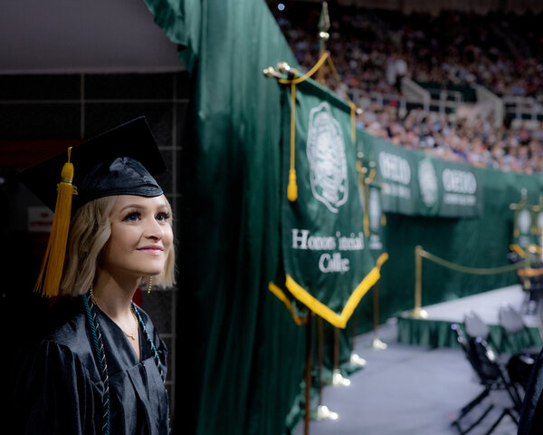 Student walks out onto the Convo floor during Commencement.