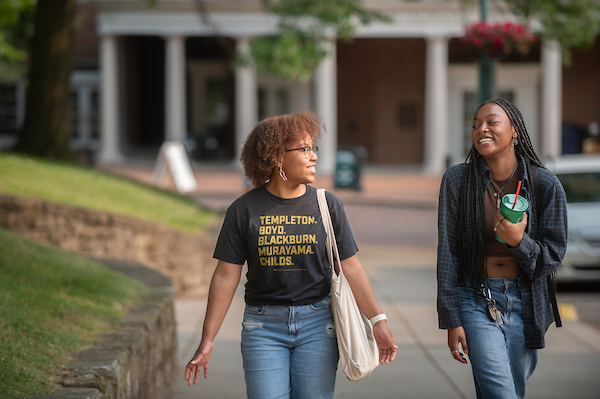 Students walk across OHIO's historic campus.