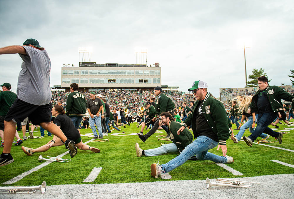 The alumni marching band performs on the field