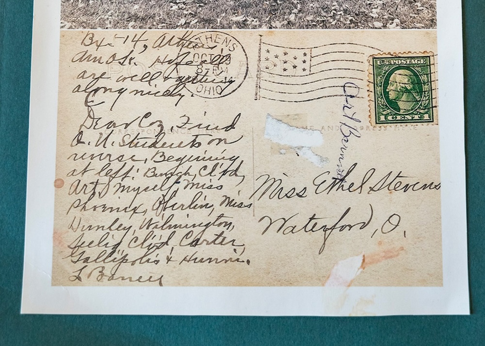 Writing on a postcard from the early 20th century