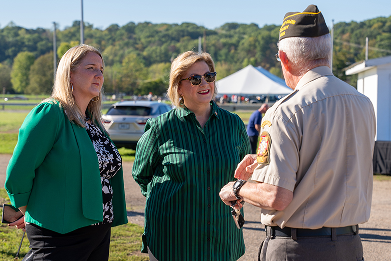 Vice President for Enrollment Management Candace J. Boeninger (left) and Ohio University President Dr. Lori Stewart Gonzalez (center) talk with a veteran (right) at the Stand Down.