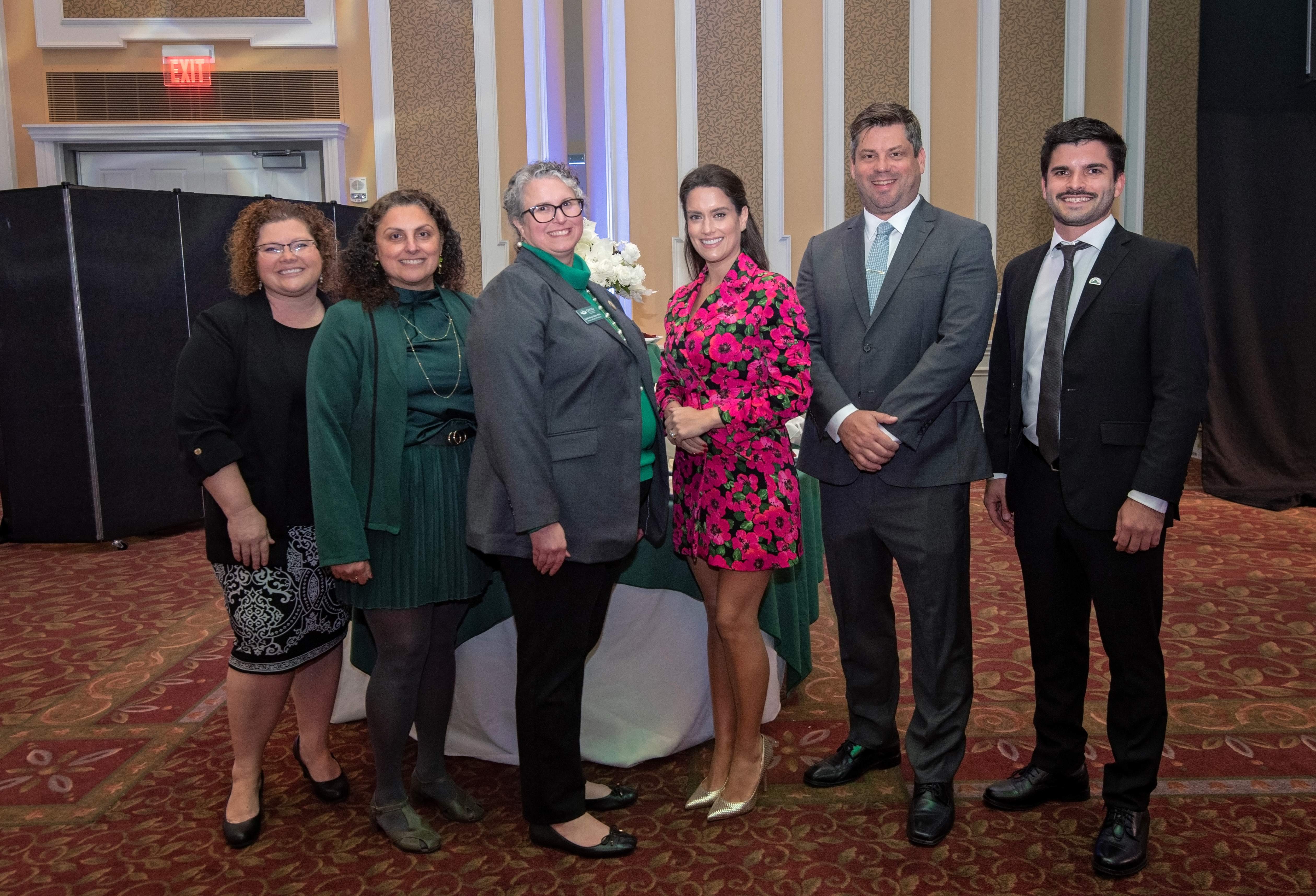 A group of faculty standing together, including Luisa Vilela de Souza Fauri, LAIOB's CEO and Janna Chimeli, the program director.