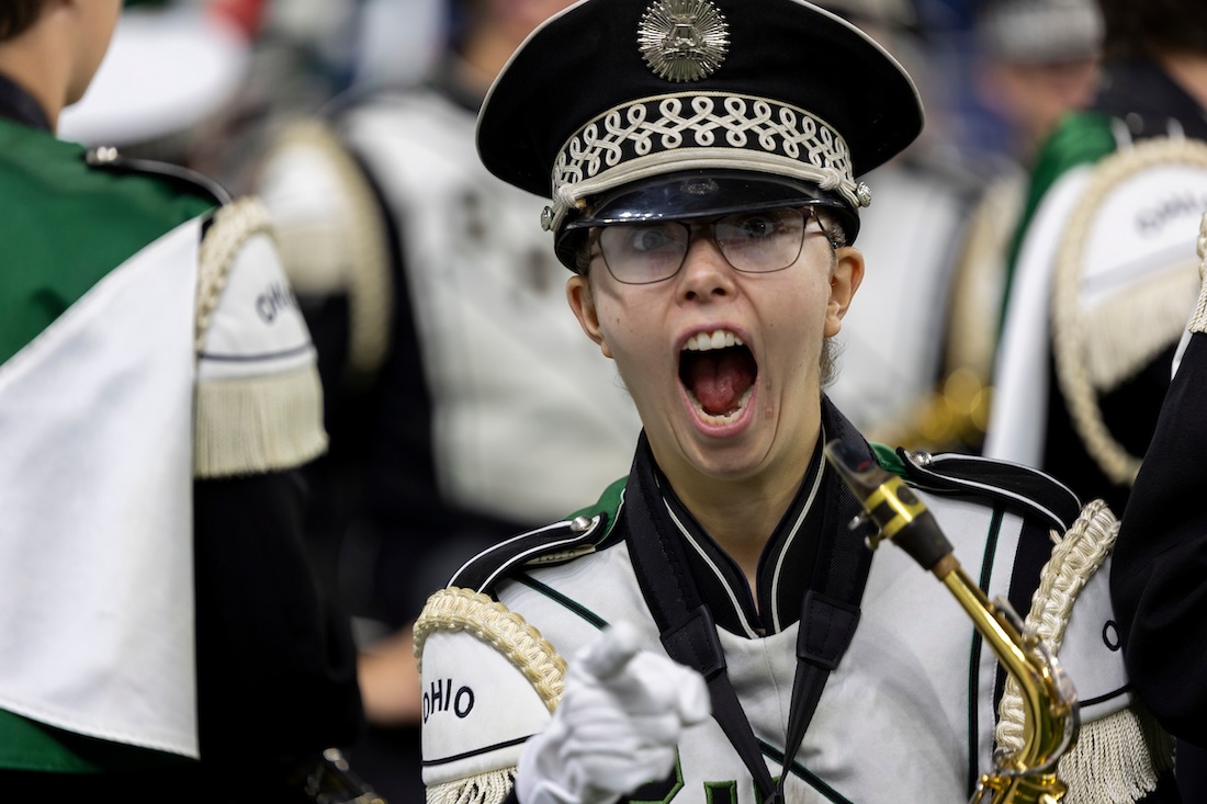 A Marching band member appears to scream excitedly at the camera