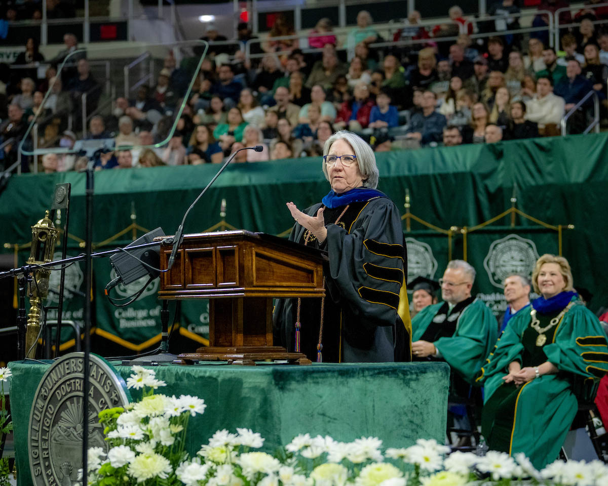 Professor Sarah Wyatt speaks at the Fall 2024 commencement ceremony