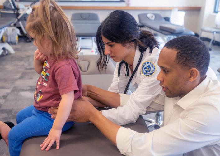 Medical students at Ohio University examine a young patient