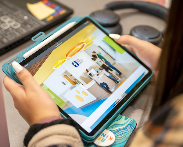 Student holding a tablet