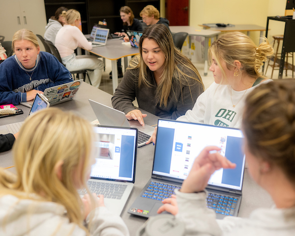 Students talking at a table