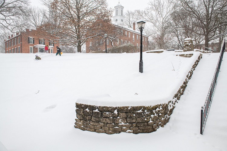 Individuals sled down the amphitheater near Scripps Hall and the College Green