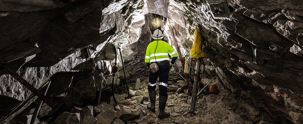 Geologist inspecting mining cave