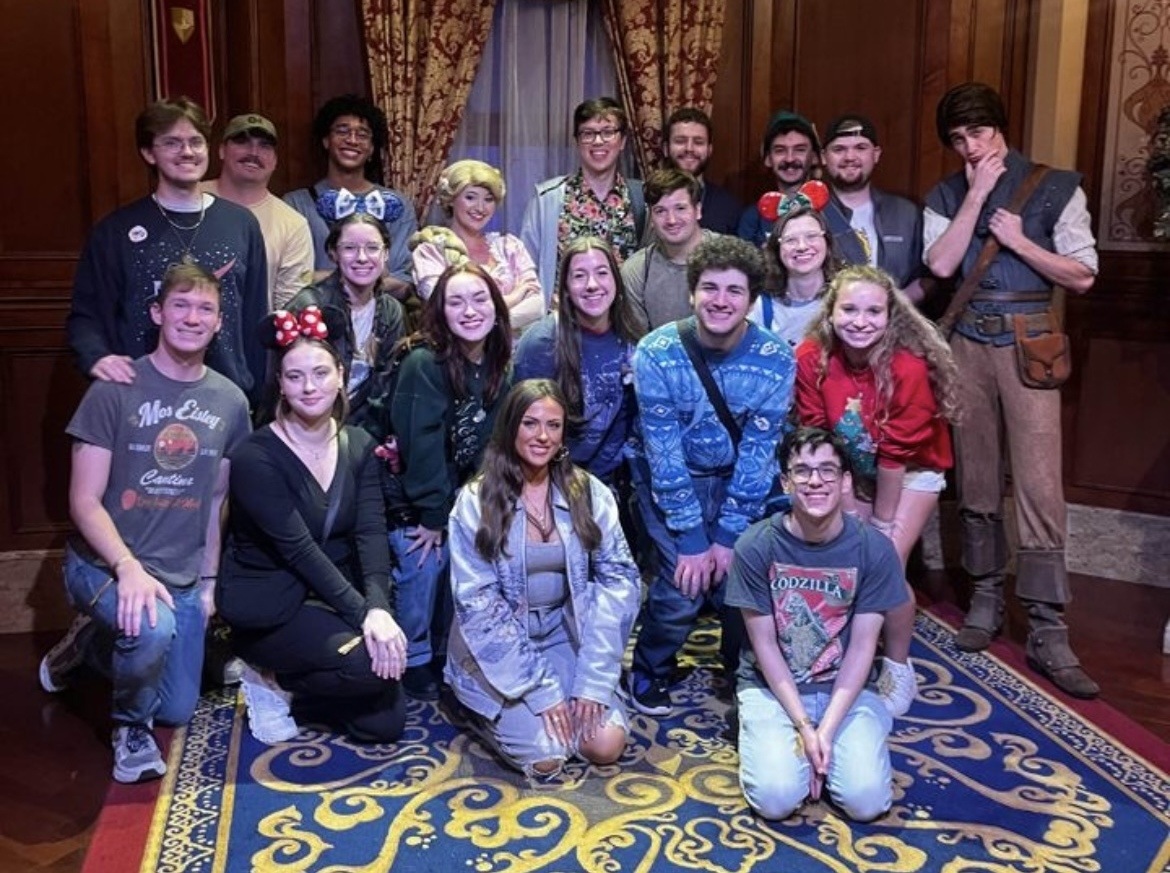 Students pose for photo at Disney