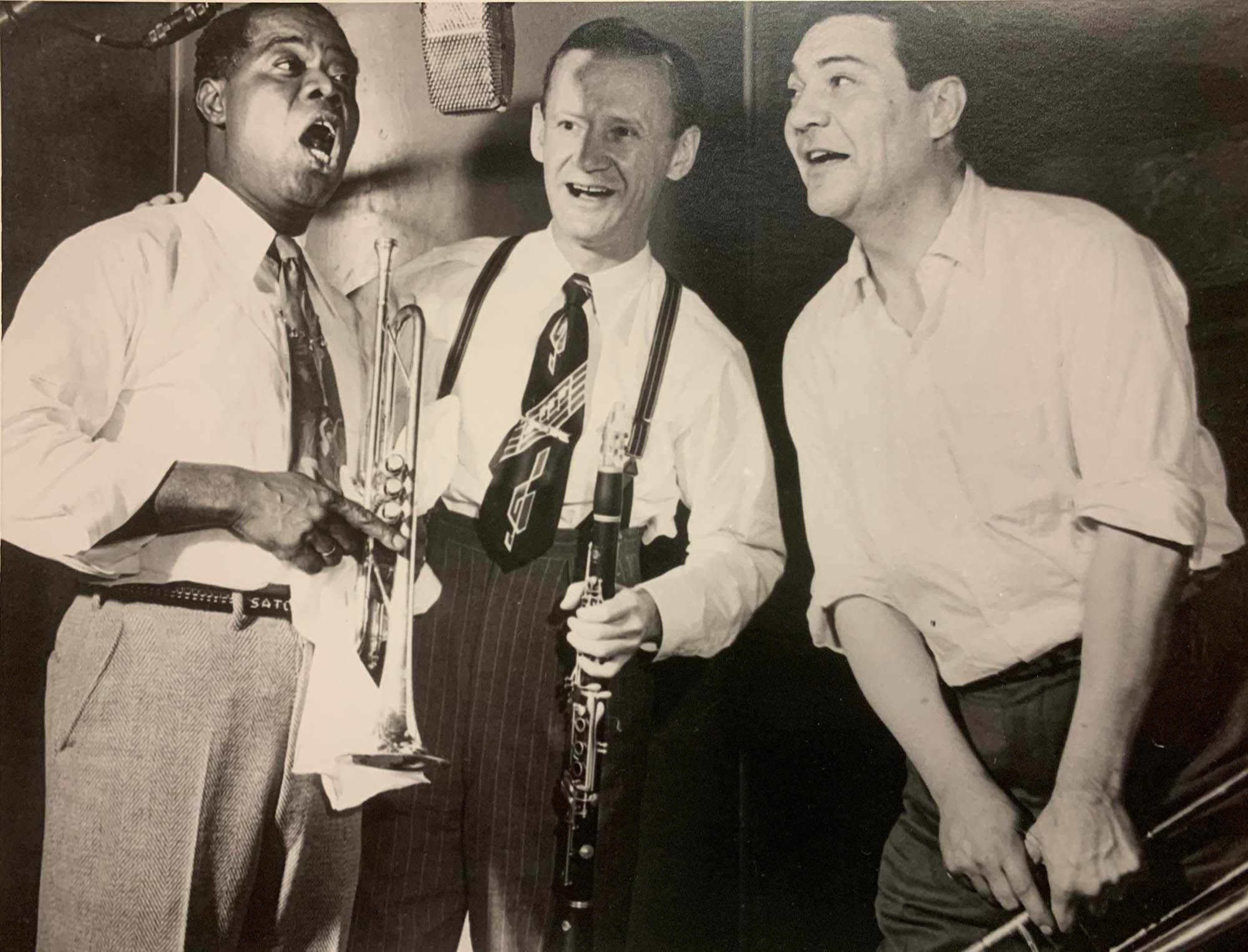 vintage photo of three men singing in shirtsleeves and ties