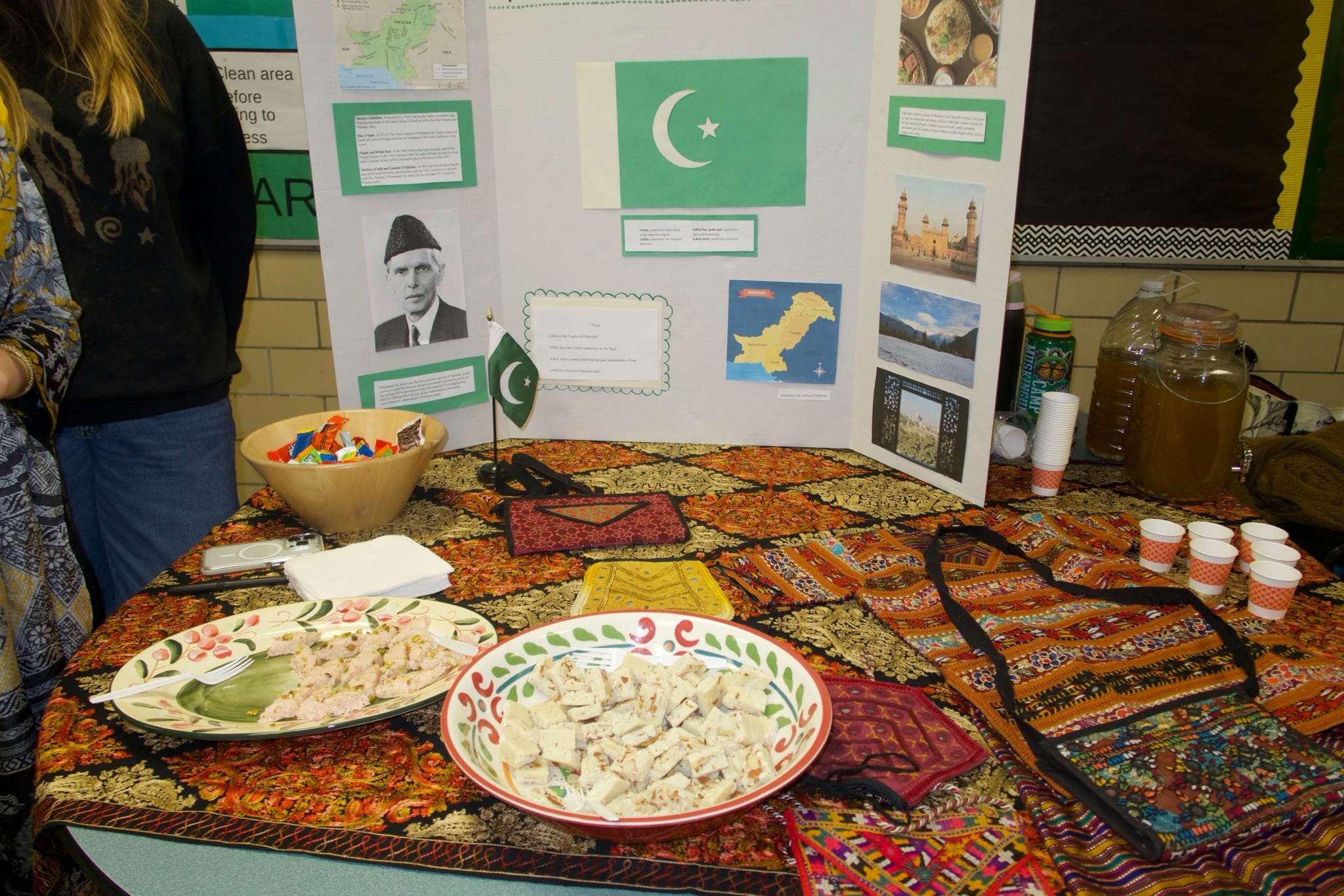 A table with a tri-fold and snacks.