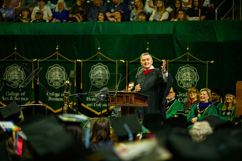 John P. Gainor speaks to the graduates at Spring Commencement in the Convocation Center