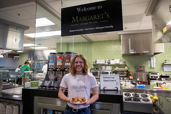 A student stands in front of Margaret’s Made for You.