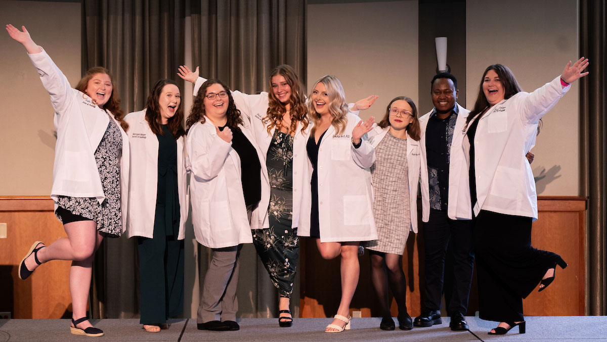 Ohio University audiology doctoral students celebrating during white coat ceremony